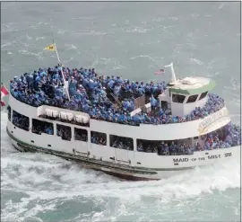  ?? — PHOTO ABOVE REUTERS, PHOTO RIGHT POSTMEDIA NEWS ?? The Maid of the Mist boats have carried millions of tourists to the base of the Horseshoe Falls on the Canadian side at Niagara Falls since 1846.