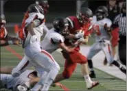  ?? GENE WALSH — DIGITAL FIRST MEDIA ?? Upper Dublin’s Cody Deussing get run out of bounds after picking up a first down Friday night.