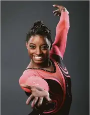  ?? Jae C. Hong / Associated Press ?? Gymnast Simone Biles was put in foster care before being adopted by her grandparen­ts.