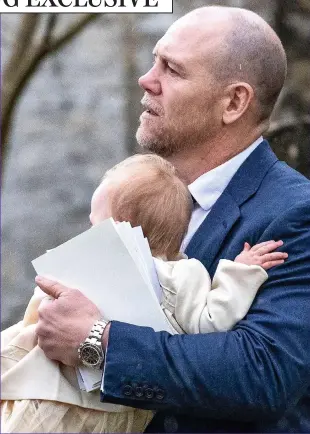  ??  ?? Safe in Daddy’s arms: Mike Tindall carries Lena from the church
