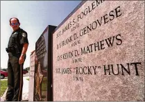  ?? LANNIS WATERS / THE PALM BEACH POST 1998 ?? In June 1998, then-Palm Beach County Sheriff’s Lt. Matt Eisenberg looks at the name of Sgt. James “Rocky” Hunt on a memorial to sheriff’s deputies killed in the line of duty. Hunt’s killer, Nicholas Hardy, is serving life without parole.