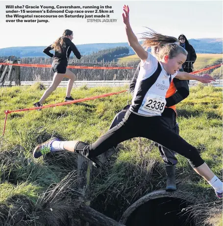  ?? STEPHEN JAQUIERY ?? Will she? Gracie Young, Caversham, running in the under15 women’s Edmond Cup race over 2.5km at the Wingatui racecourse on Saturday just made it over the water jump.