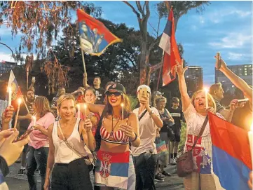  ?? ?? PROTEST: Supporters gather outside the Park Hotel where Djokovic is being detained.