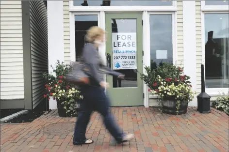  ?? ASSOCIATED PRESS ?? IN THIS SEPT. 2 FILE PHOTO, a shopper walks by one of several vacant retail spaces among the outlet shops in Freeport, Maine. The U.S. unemployme­nt rate dropped to 7.9% in September, but hiring is slowing and many Americans have given up looking for work, the government said Friday in the final jobs report before the voters decide whether to give President Donald Trump another term.