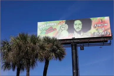  ?? TNS
(above);
Thearon W. Henderson
/ Getty Images /TNS (left) ?? A billboard illustrati­on promoting Colin Kaepernick's Change the Whirled ice cream flavor by Ben and Jerry's is seen intampa on Feb. 4 (above). The San Francisco 49ers' Colin Kaepernick (7) and Eric Reid (35) kneel in protest during the national anthem prior to playing the Los Angeles Rams at Levi's Stadium on Sept. 12, 2016, in Santa Clara.