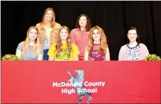  ?? RICK PECK/SPECIAL TO MCDONALD COUNTY PRESS ?? Hannah Leonard (seated, second from left) recently signed a letter of intent to join the cheerleadi­ng squad at Missouri Southern State College. Front row, left to right: Kodie Leonard (sister),Hannah Leonard, Monica Willyard (mom) and Aubrey Endicott...