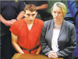  ?? SUSAN STOCKER/SOUTH FLORIDA SUN-SENTINEL VIA AP, POOL ?? A video monitor shows school shooting suspect Nikolas Cruz in an appearance Thursday before Judge Kim Theresa Mollica in Broward County Court in Fort Lauderdale, Fla.