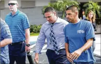  ?? BRUCE R. BENNETT / THE PALM BEACH POST ?? Boynton Beach police Sgt. Philip Antico (center) in November leaves a West Palm Beach courtroom after federal jurors found him guilty of obstructio­n of justice and acquitted him of falsifying records. Antico is free on bond until his sentencing.