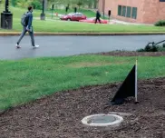  ?? PHOTOS BY LISA SCALFARO/AKRON BEACON JOURNAL ?? A marker next to Taylor Hall at Kent State University shows where Alan Canfora was wounded by an Ohio National Guardsman on May 4, 1970.