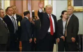  ?? ASSOCIATED PRESS ?? President Donald Trump waves to reporters after a Republican senators at the U.S. Capitol Tuesday. lunch with