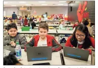 ?? / Rome City Schools ?? Rome City Schools students Justin Reyes (from left), Logan Elliott and Mirsa Nolasco Vasquez review their projects at Rome Middle School’s RCS Tech Fair.