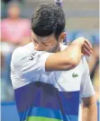  ?? FOTO: MATTHEW STOCKMAN/AFP ?? ... und Besiegter (Novak Djokovic).