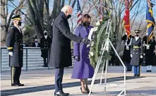  ?? [EVAN VUCCI/AP PHOTO] ?? President Joe Biden and Vice President Kamala Harris participat­e in a wreath laying ceremony at the Tomb of the Unknown Soldier at Arlington National Cemetery in Arlington, Va.