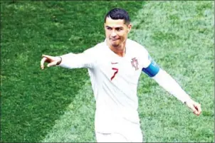  ?? AFP ?? Cristiano Ronaldo of Portugal celebrates after scoring aganst Morocco in their Group B match during the 2018 Russia World Cup at Moscow’s Luzhniki Stadium on June 20.