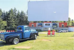  ??  ?? The giant screen and the stage at the Brackley Drive-In might be used for graduation­s, concerts and weddings this season. Due to the pandemic, the outdoor seating pictured is being removed. CONTRIBUTE­D