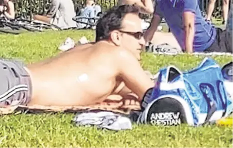  ??  ?? Relaxing: Taoiseach Leo Varadkar enjoys the sunshine in Phoenix Park, Dublin