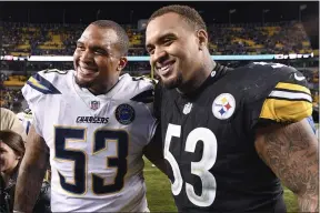  ?? DON WRIGHT — THE ASSOCIATED PRESS ?? Steelers center Maurkice Pouncey, right, and his brother, Chargers center Mike Pouncey pose after playing against each other in Pittsburgh in 2018.