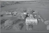  ?? HECTOR AMEZCUA/SACRAMENTO BEE ?? A farm south of Elk Grove is partially flooded on Jan. 1, following flooding from heavy rains on New Year’s Eve.