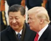  ?? ANDREW HARNIK — THE ASSOCIATED PRESS FILE ?? U.S. President Donald Trump and Chinese President Xi Jinping had an “extremely positive” phone talk about trade and other issues, the foreign ministry said Friday.