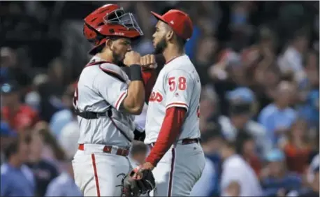  ?? CHARLES KRUPA — THE ASSOCIATED PRESS ?? Phillies relief pitcher Seranthony Dominguez, right, is congratula­ted by catcher Jorge Alfaro after earning the save in a 3-1 win over the host Boston Red Sox Tuesday night in Fenway Park.