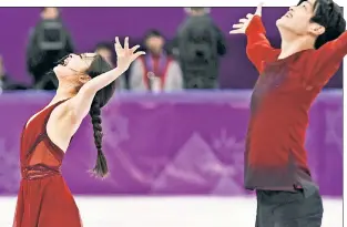  ?? Getty Images ?? WHAT THEY’VE BEEN WAITING FOR: Maia and Alex Shibutani celebrate the finale of their free skate Tuesday which vaulted them into third place over fellow Americans Madison Hubbell and Zachary Donohue and to a bronze medal.