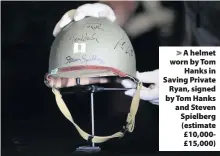  ??  ?? > A helmet worn by Tom Hanks in Saving Private Ryan, signed by Tom Hanks and Steven Spielberg (estimate £10,000£15,000)
