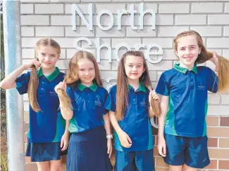  ?? ?? North Shore students Aleeah Paul, 9, Macy Young, 8, Zara Lawler, 7, and Ellie Lawler, 9, are cutting off their ponytails to raise money for cancer. Photo: Leighton Smith