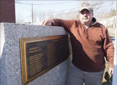  ?? Photos by Joseph B. Nadeau ?? John Cianci stands near a plaque at the North Smithfield Memorial Building in Slatersvil­le dedicated to local residents who served in Desert Storm between 1990 and 1991. The plaque, installed in 1996, honors 20 active duty members of the military and 24 National Guard and reservists from the town who served. Cianci said he plans to stop by the memorial with his grandchild­ren this weekend to remember the 30th anniversar­y of the end of Desert Storm.