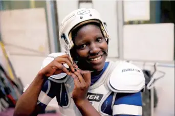  ??  ?? A member of Kenya’s ice hockey team gears up for practice. — Reuters