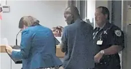  ?? WPEC-CBS12/COURTESY ?? U.S. Marshals and Broward Sheriff’s Office authoritie­s arrested Pascal Estime, center, at Fort Lauderdale-Hollywood Internatio­nal Airport before he boarded a plane for Haiti.