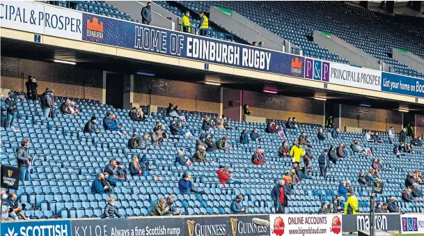  ??  ?? MIND THE GAP: Socially-distanced rugby fans during the Guinness Pro-14 match between Edinburgh and Glasgow Warriors at BT Murrayfiel­d at the end of last month