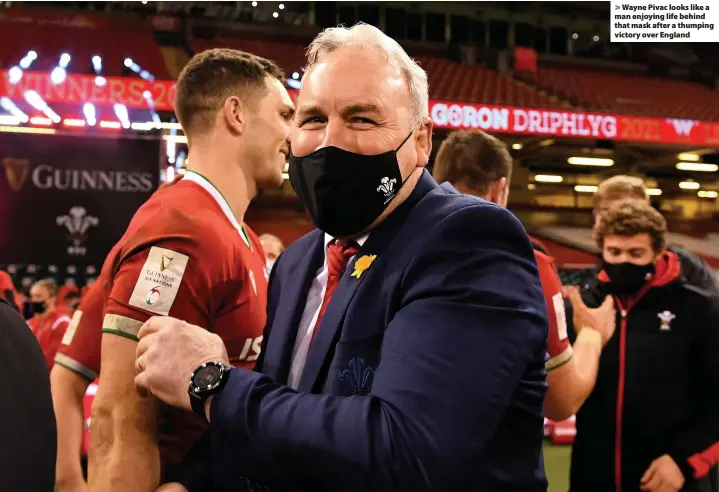  ??  ?? > Wayne Pivac looks like a man enjoying life behind that mask after a thumping victory over England