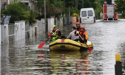  ?? Photograph: Gianluca Ricci/LPS/ZUMA Press Wire/Shuttersto­ck ?? Rescuers paddle down a flooded street in Lugo di Romagna, Italy. More than 36,000 people have been displaced and 14 people killed after heavy downpours caused floods and landslides.