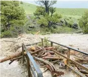  ?? NATIONAL PARK SERVICE ?? A washed-out bridge is shown last Monday from flooding at Rescue Creek in Yellowston­e National Park in Montana. The greatest damage seems to be roads.