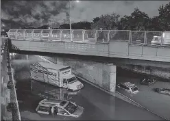  ?? AFP ?? Cars stranded on an expressway in Brooklyn following heavy rain in New York on Wednesday.