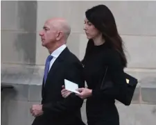  ?? GETTY IMAGES FILE ?? BAD MOVE: Amazon CEO Jeff Bezos, with his wife Mackenzie in September in Washington, should have known better when he sent racy text messages to another woman while still married to his wife.