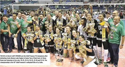  ??  ?? THE DE LA SALLE LADY SPIKERS are the UAAP Season 79 champions after defeating rivals Ateneo Lady Eagles in Game Two of their best-of-three finals last Saturday in five sets, 19-25, 25-14, 18-25, 25-18 and 15-10. The championsh­ip is the 10th UAAP...