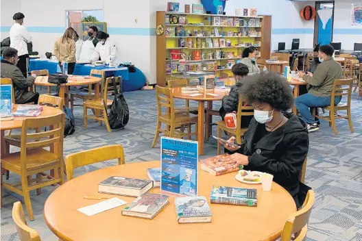  ?? SCHOOL DISTRICT 228 ?? Students at Hillcrest High School in Country Club Hills recently attended a book-tasting event with titles from various genres and snacks with matching themes provided by the Culinary Club.