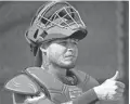  ?? DAVID J. PHILLIP/AP ?? Cardinals catcher Yadier Molina, seen during a spring training game Feb. 14, has finalized a contract extension with St. Louis than runs through the 2020 season.