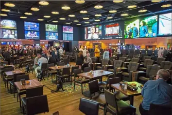  ?? Jessie Wardarski/Post-Gazette ?? Rivers Casino Pittsburgh’s new state-of-the-art BetRivers Sportsbook was unveiled in September 2019 on the North Shore. The casino hopes the return of big crowds will deliver a lot of returning handle for the sportsbook, which was deprived of a lot of it in 2020.