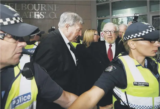  ?? PICTURE: MICHAEL DODGE/GETTY IMAGES ?? 0 Cardinal George Pell arrives at Melbourne Magistrate­s’ Court with lawyer Robert Richter QC