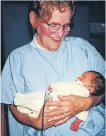  ??  ?? Mary in 1994, at age 80, holding Victoria Newson, her youngest granddaugh­ter.