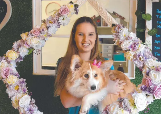  ?? Picture: STEVE HOLLAND ?? Georgia Furniss with one of the pampered pooches at her dog grooming business The Dog House in Palm Beach.