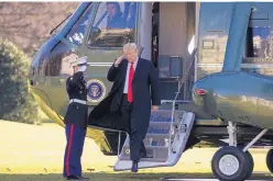  ?? ALEX BRANDON/ASSOCIATED PRESS ?? President Donald Trump salutes as he steps off Marine One on the South Lawn of the White House on Sunday in Washington. Trump was returning from a trip to Camp David.