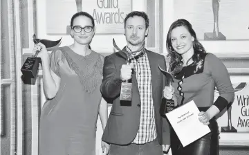  ??  ?? (From left) Writers Jessi Klein, Kyle Dunnigan, and Christine Nangle, recipients of the Comedy/Variety Sketch Series award for ‘Inside Amy Schumer,’ pose in the Press Room during the 2016 Writers Guild Awards on Feb 13, 2016 in Los Angeles, California....