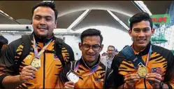  ??  ?? Heroes all: Ziyad, Ridzuan and Abdul Latif with their medals