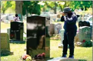  ?? (AP/Matt Rourke) ?? Sean Williams visits on May 9 the grave of Samara Banks and her three children who were killed while crossing Roosevelt Boulevard. Williams is the father of two of the children who died.