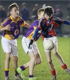  ??  ?? Matthew Kelly (Ferns) is tackled by Shamrath Flynn (Wexford C.B.S.).