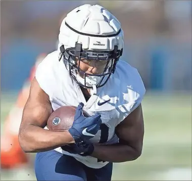  ?? Joe hermitt/pennlive.com/tnS ?? Penn State running back Nick Singleton runs a drill on the first day of spring practice on March 21.