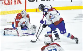  ?? Fred Greenslade The Canadian Press via AP ?? Colorado goaltender Alexandar Georgiev stops a shot by Winnipeg ’s Alex Iafallo, one of his 28 saves.